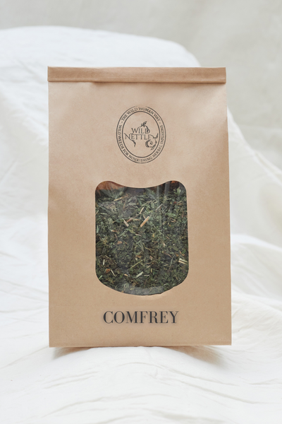 Kraft paper package of comfrey on a white background